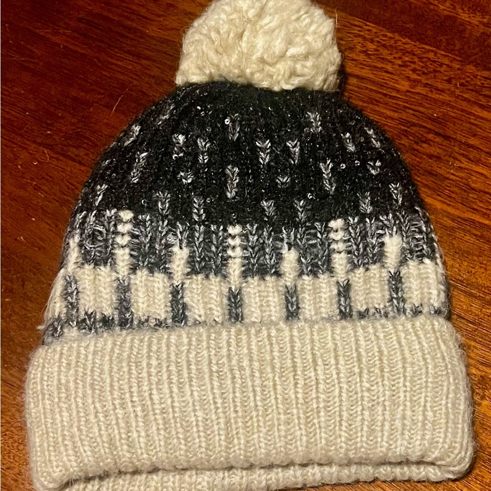 Black and Cream Knitted Winter Hat with Pom-Pom and Cozy Texture